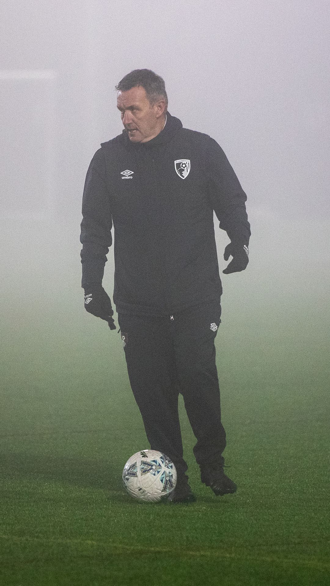 Steve Cuss with a ball at his feet at AFC Bournemouth Women's Training