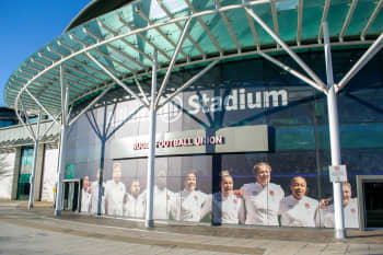 The Red Roses team picture on the side of Twickenham Stadium