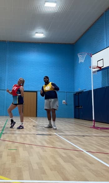 Mixed gender netball game, by Libby Evans