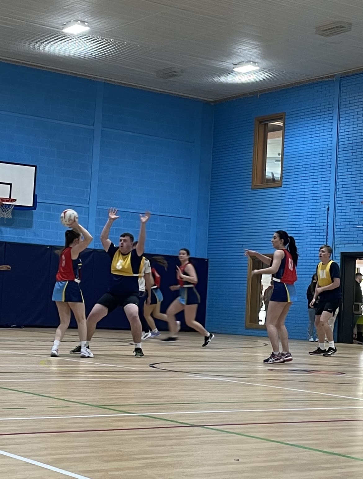 Mixed gender netball game, by Libby Evans