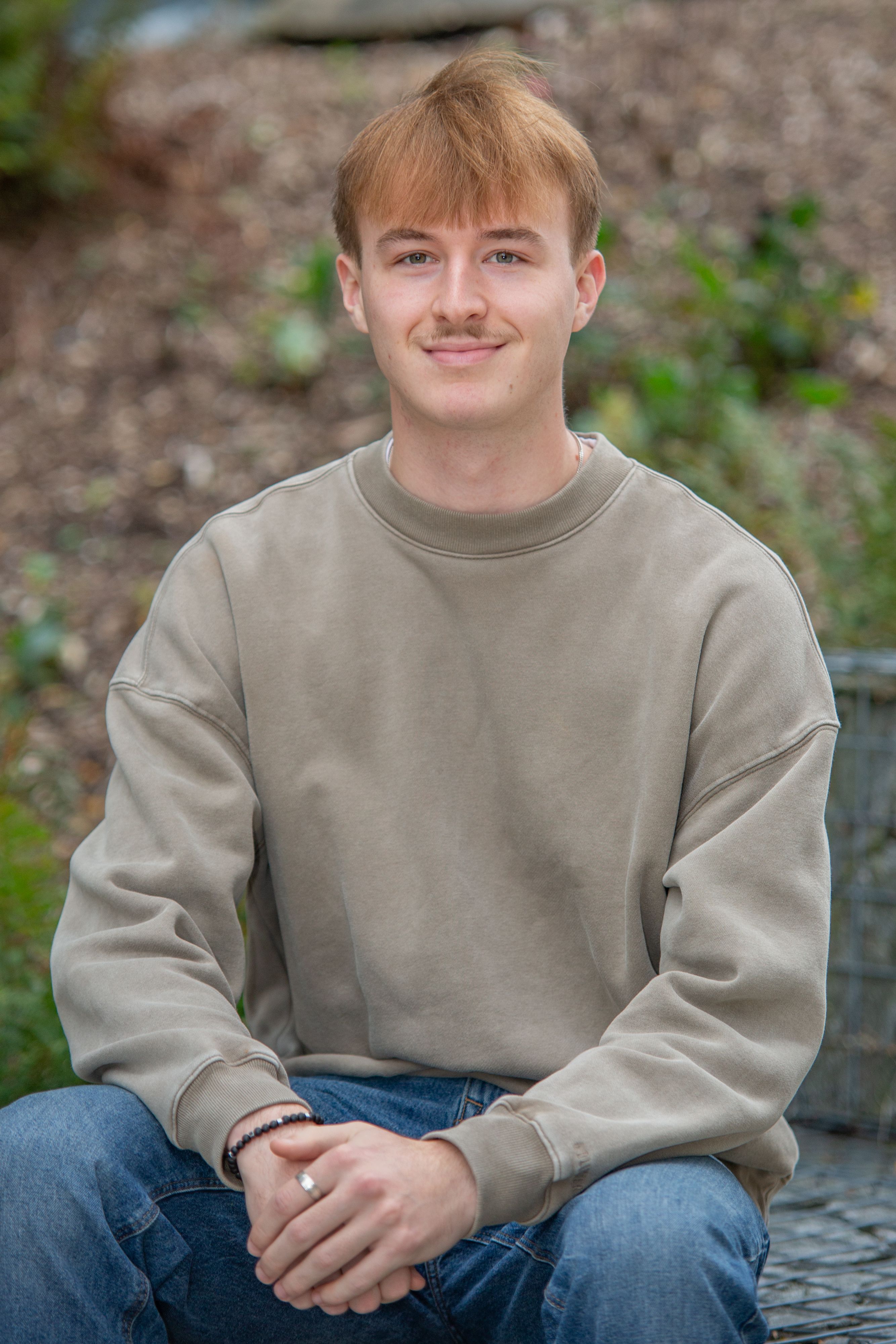 woman wears black long-sleeved dress