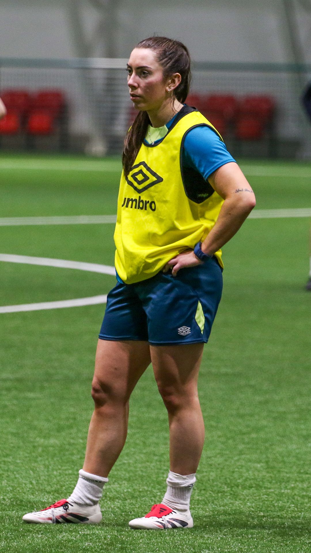 Gemma McGuiness wearing AFC Bournemouth training kit and a yellow umbro bib