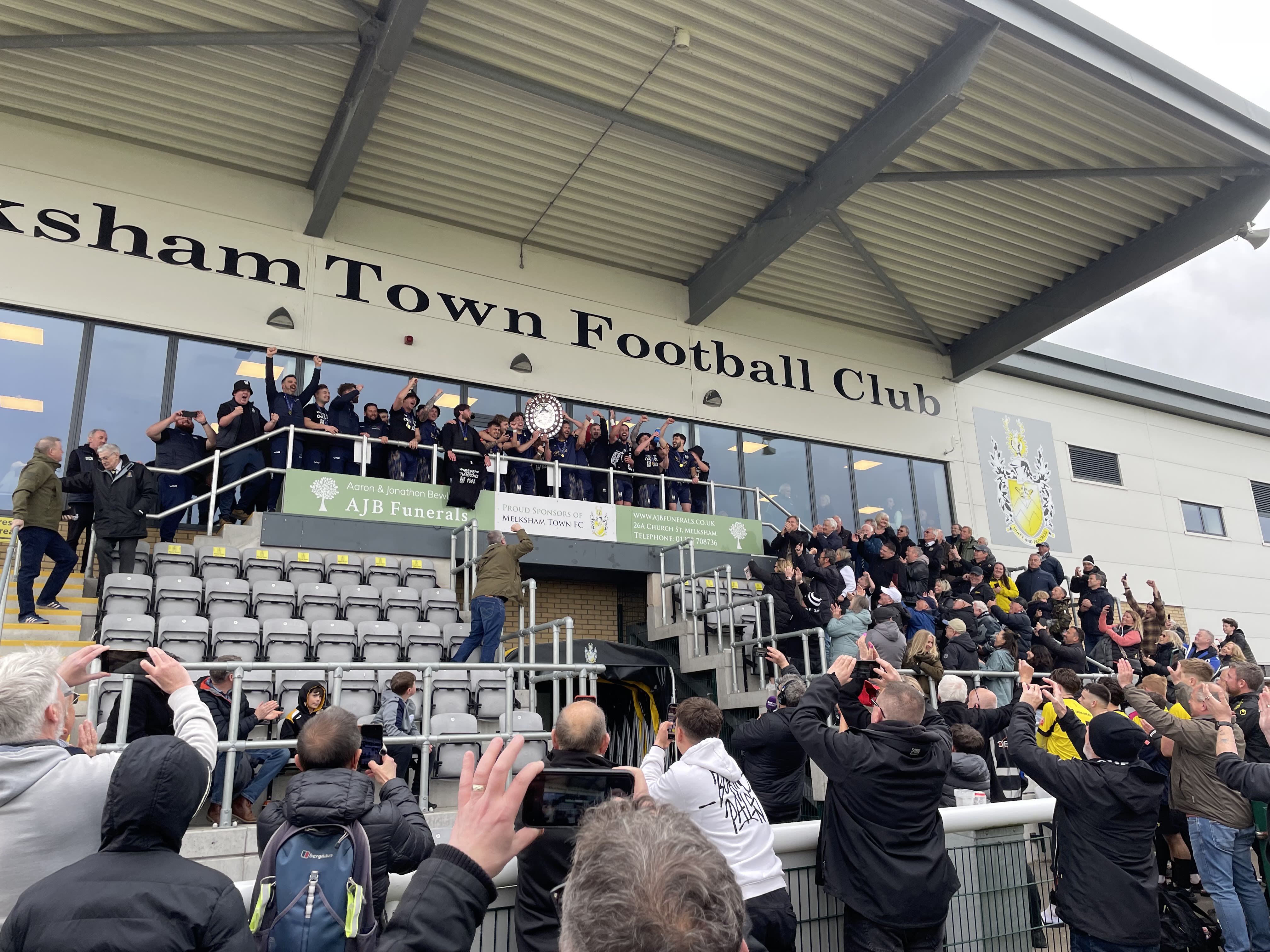 Wimborne lift the league title at Melksham | Photo by Jimmy Bowie
